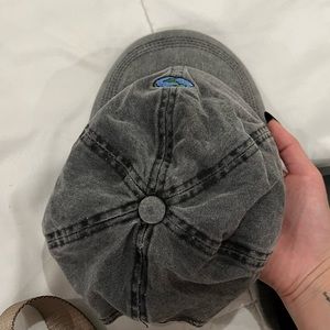 grey faded hat with earth